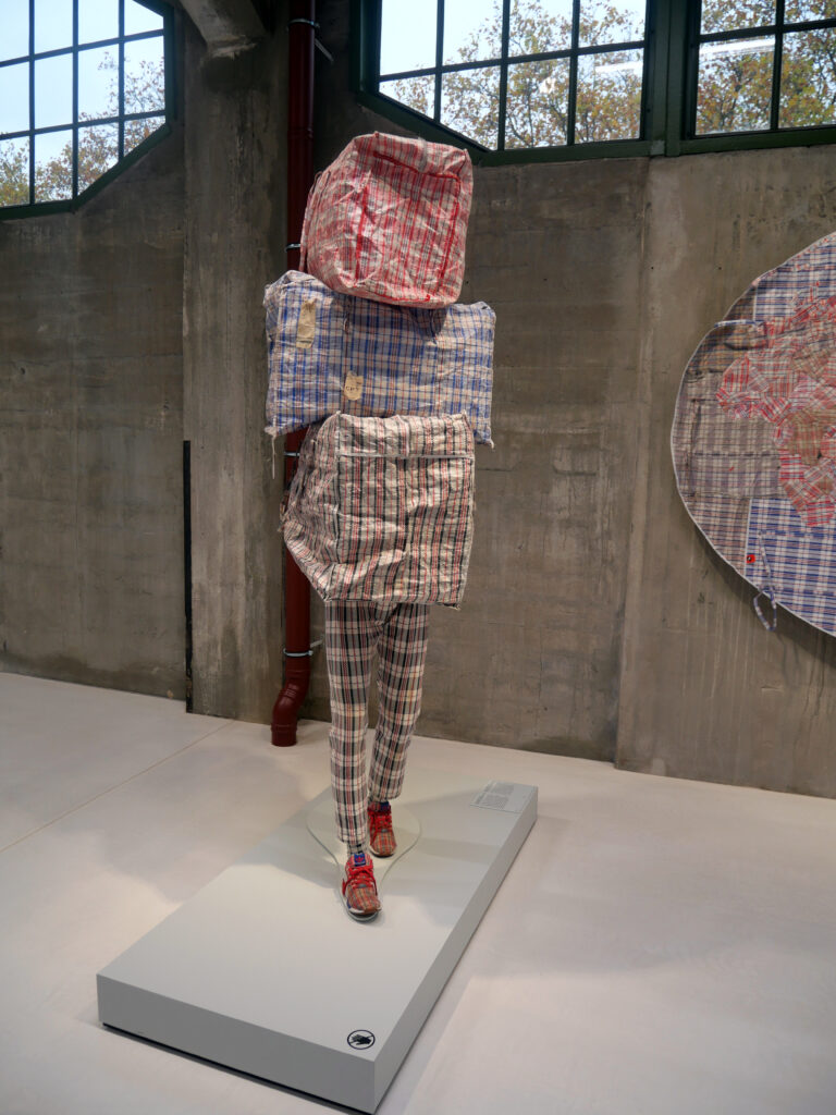 An image of a migrant made from plastic bags, sometimes called a Turkish suitcase.